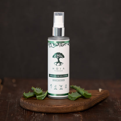 Organic Aloe Water 100ML a natural cosmetic product by HOIA on a wooden table